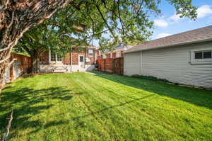 Fully-fenced backyard and garage.