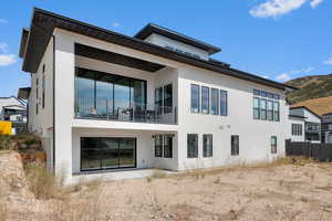 Rear view of house with a balcony