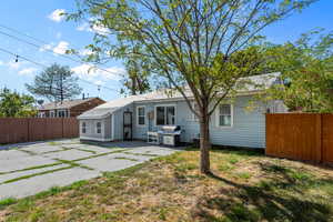 Back of property with a patio