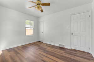 Bedroom 1 - new LVP floors, closet, and ceiling fan