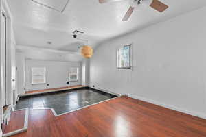 Bedroom 3 - ceiling fan, and exit to back yard and garage.