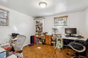 Office with wood-type flooring