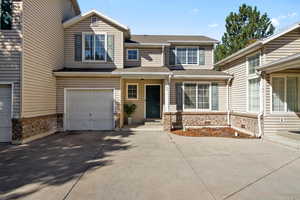 View of front of property featuring a garage