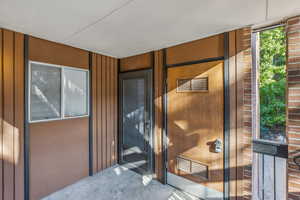 View of doorway to property and utility room.