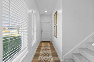 Hall with wood-type flooring *Photo is of an existing home of the same layout. Colors for listed home could vary*