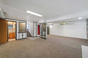 Basement with light carpet