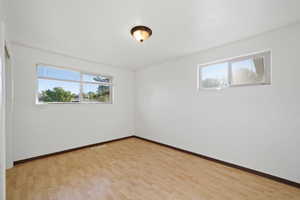 Spare room featuring light hardwood / wood-style flooring