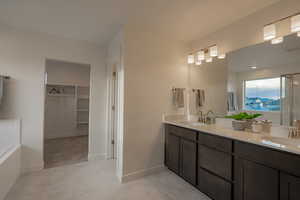 Primary Bathroom with Dual Vanity & Separate Tub & Shower