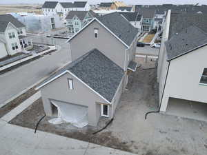 Exterior of home with separate entrance to basement