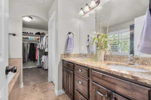 Primary Suite Bathroom featuring vanity and tile patterned flooring