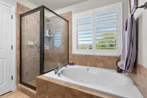 Large Primary Suite Bathroom featuring independent shower and bath