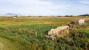 View of yard with a mountain view and a rural view