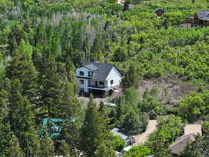 View from above of property featuring a forest
