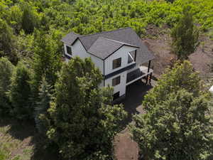 View from above of property featuring a forest