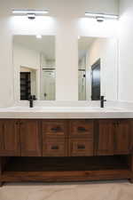 Bathroom featuring vanity and walk in shower