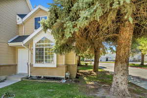 View of front of house with a front yard