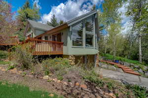 View of property exterior with a deck