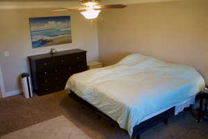 Bedroom featuring carpet flooring and ceiling fan