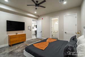 Bedroom with ensuite bath and ceiling fan