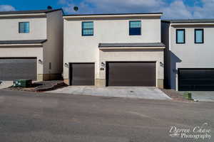 View of front of property featuring a garage