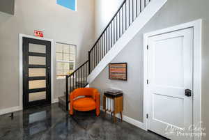 Entrance foyer featuring a high ceiling