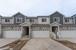 View of front facade featuring a garage