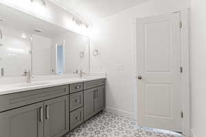 Bathroom with vanity and a textured ceiling