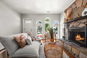 Living room featuring a fireplace and hardwood / wood-style flooring