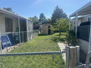 View of yard featuring a storage shed