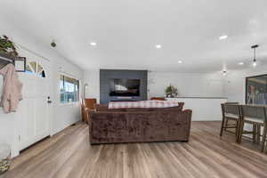 Living room with light hardwood / wood-style floors