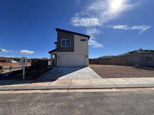 View of front of home featuring a garage