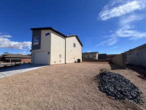 Exterior space with a garage and central air condition unit