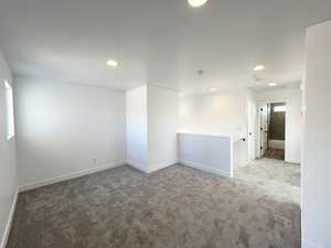 Empty room featuring carpet floors