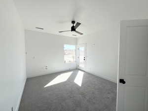 Unfurnished room with carpet floors and ceiling fan