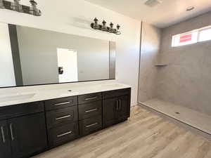 Bathroom featuring vanity and hardwood / wood-style floors