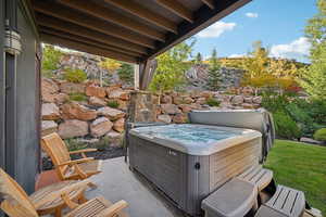 Exterior space with a hot tub