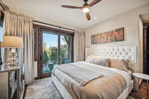 Bedroom featuring ceiling fan and access to exterior