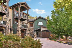 Exterior space featuring a balcony and a garage