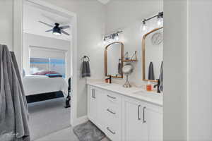 Bathroom with vanity and ceiling fan