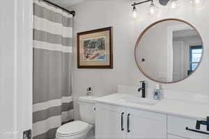 Bathroom with vanity and toilet