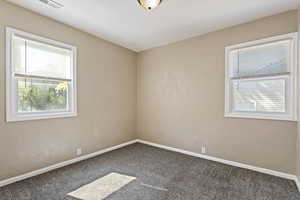 View of carpeted spare room