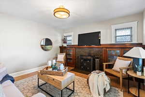 Living room with  plenty of natural light, and a fireplace