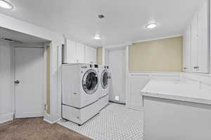 Clothes washing area with independent washer and dryer and cabinets