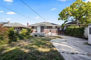 Back of house featuring a yard and a patio