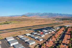 Birds eye view of property with a mountain view