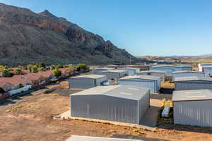 Exterior space featuring a mountain view and an outdoor structure