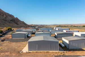 Exterior space with a mountain view and an outdoor structure