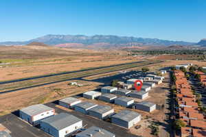 Birds eye view of property with a mountain view