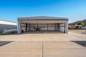 Garage featuring a carport and a mountain view