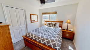 Bedroom featuring a closet and ceiling fan